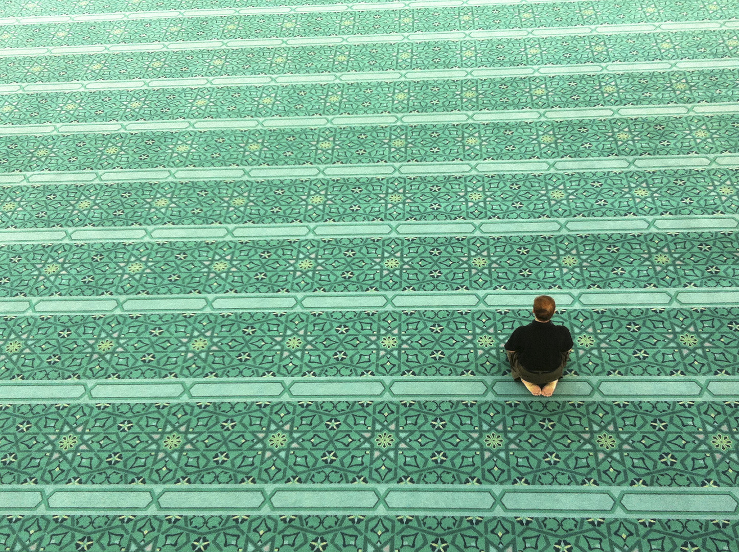 man sitting in mosque 2